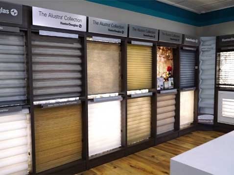 Store interior showcasing several different types of window coverings